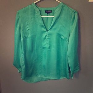 The limited teal blouse